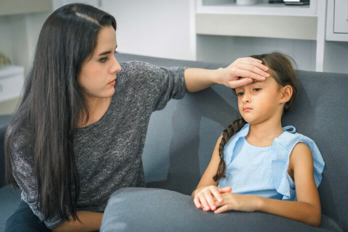 Mother take care of sick daughter. concept of family and healthy.